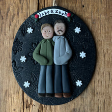 Load image into Gallery viewer, Decorative ornament with two people and 'Jake & Zach' text on a wooden surface