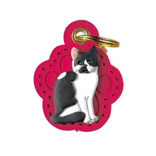 Load image into Gallery viewer, Keychain with a cat design on a pink background