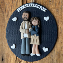 Load image into Gallery viewer, Decorative item with figurines and 'The Lopez Family' text on a wooden surface
