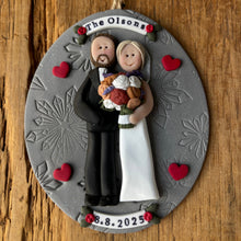 Load image into Gallery viewer, Personalized ornament with a couple holding flowers on a wooden background
