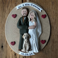 Load image into Gallery viewer, Decorative ornament with a couple and dog on a wooden background
