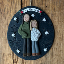 Load image into Gallery viewer, Personalized ornament with two people's faces on a wooden background

