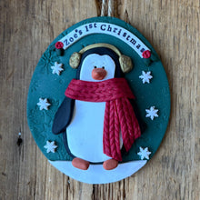 Load image into Gallery viewer, Decorative penguin ornament with a red scarf on a wooden surface

