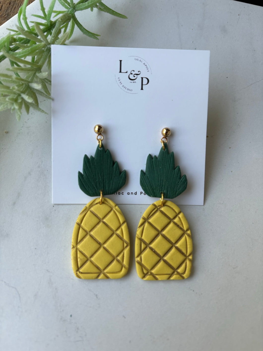 Pineapple earrings.